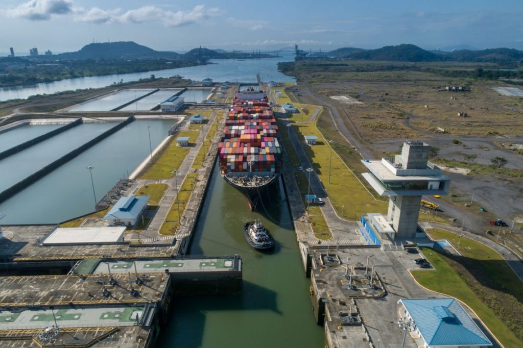 A large container ship transiting through the Panama Canal.