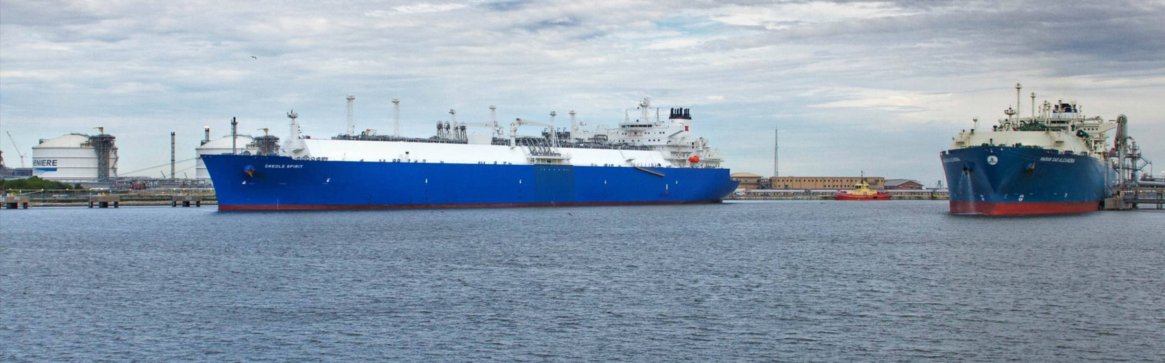 A large LNG carrier ship at sea, transporting liquefied natural gas.